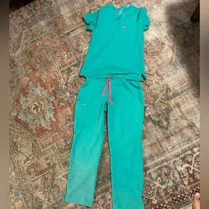 Figs Scrubs size Large. Top and bottom. Color is Surgical Green